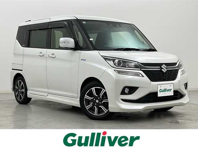 スズキ ソリオ バンディット HV MV 宮城県 2018(平30)年 3.4万km ピュアホワイトP スズキセーフティサポート	/・車線逸脱抑制制御機能	/・車線逸脱警報機能	/・パーキングソナー	/・横滑り防止装置/・ハイビームアシスト	/デュアルカメラブレーキ/全方位カメラ/両側パワースライドドア/純正8型ナビ/・SD.DVD.CD.BT/フルセグTV/運転席シートヒーター/パドルシフト/ステアリングスイッチ/ビルトインETC/ドライブレコーダー（F）/LEDヘッドライト/LEDフォグランプ/アイドリングストップ/横滑り防止装置/純正15inAW/純正フロアマット/後席ロールサンシェード/シートバックテーブル