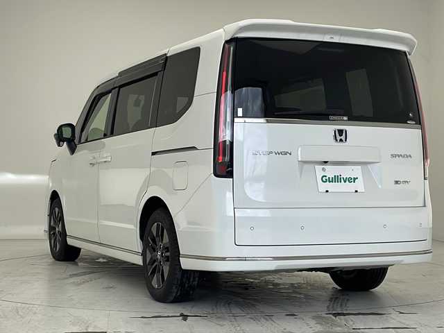 ホンダ ステップワゴン スパーダ eHEV 沖縄県 2022(令4)年 2.1万km プラチナホワイトパール 純正11.4インチナビ(LXM-237VFLi)/（フルセグTV　DVD　Bluetooth接続）/バックカメラ/純正15.6インチフリップダウンモニター/ETC/ドライブレコーダー/ステアリングスイッチ/クルーズコントロール/パドルシフト/両側パワースライドドア/ハーフレザーシート/シートヒーター/パワーバックドア/クリアランスソナー/LEDヘッドライト/オートライト/スマートキー/スペアキー/プッシュスタート/純正フロアマット/純正16インチアルミホイール/保証書/取扱説明書