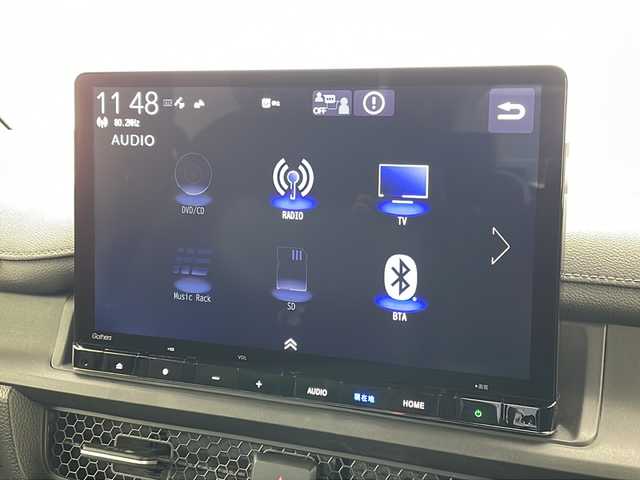 ホンダ ステップワゴン スパーダ eHEV 沖縄県 2022(令4)年 2.1万km プラチナホワイトパール 純正11.4インチナビ(LXM-237VFLi)/（フルセグTV　DVD　Bluetooth接続）/バックカメラ/純正15.6インチフリップダウンモニター/ETC/ドライブレコーダー/ステアリングスイッチ/クルーズコントロール/パドルシフト/両側パワースライドドア/ハーフレザーシート/シートヒーター/パワーバックドア/クリアランスソナー/LEDヘッドライト/オートライト/スマートキー/スペアキー/プッシュスタート/純正フロアマット/純正16インチアルミホイール/保証書/取扱説明書
