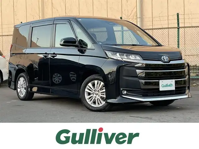 トヨタ ノア ハイブリッド S－G 東京都 2023(令5)年 1.5万km グリッターブラックガラスフレーク サイドリフトアップチルトシート装着車　/純正ナビ　/Ｂｌｕｅｔｏｏｔｈ　/フルセグＴＶ　/バックカメラ　/両側電動スライドドア　/ワンオーナー車　/シートヒーター　/純正ドライブレコーダー　/ＥＴＣ２．０/ABS/横滑り防止装置/コーナーセンサー/レーンアシスト/盗難防止装置/オートライト/オートマチックハイビーム/純正LED/衝突被害軽減システム/BSM