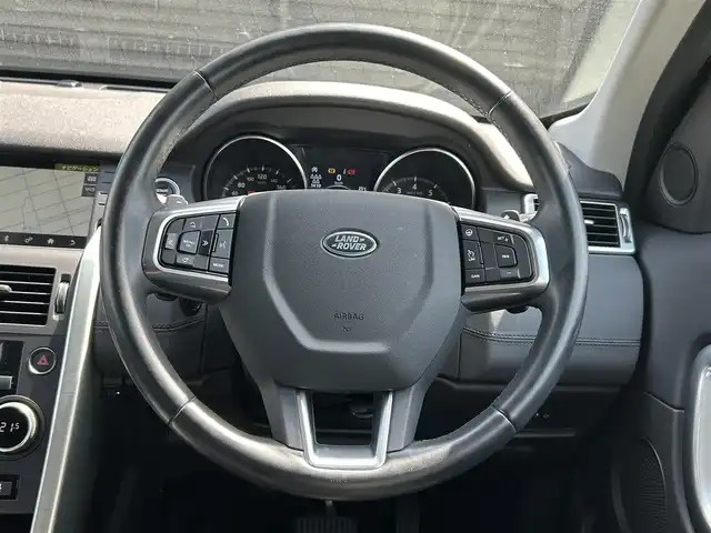 ランドローバー ランドローバー ディスカバリースポーツ　HSE 宮崎県 2019(令1)年 2.9万km ガンＭ ワンオーナー/純正ナビゲーション/・Bluetooth/・CD DVD/・USB/・フルセグTV/３列７人乗り/ETC２．０/MEDIRIANスピーカー/ハンドルヒーター/ブラインドスポットモニター/アンビエントライト/純正１９インチアルミホイール/黒レザーシート/・D/N席　パワーシート/・D/N席　シートヒーター/前後コーナーセンサー/キーレスエントリー/・スマートキー/クルーズコントロール/ボディカラー　コリスグレー/プッシュスタート