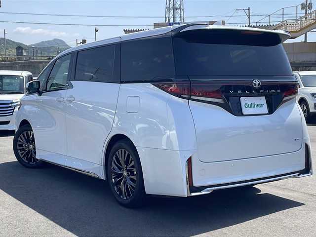 トヨタ ヴェルファイア ハイブリット Z プレミア 山口県 2025(令7)年 0.2万km プラチナホワイトパールマイカ ワンオーナー/左右独立ムーンルーフ/メーカー純正ディスプレイオーディオ＋ナビ/(フルセグ/Bluetooth)/全方位モニター/トヨタセーフティセンス/・プリクラッシュセーフティ/・レーダークルーズコントロール/・レーンキープアシスト/・オートマチックハイビーム/ブラインドスポットモニター/LEDオートライト/ヘッドアップディスプレイ/パドルシフト/レザーシート/1.2列目パワーシート・ベンチレーション/D席シートメモリ/両側パワースライドドア/パワーバックドア/デジタルインナーミラー/ユニバーサルステップ/ETC2.0