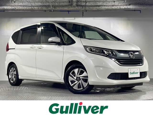 ホンダ フリード G ホンダセンシング 沖縄県 2018(平30)年 6.6万km ホワイトオーキッドパール 県外仕入　/禁煙車　/6人乗り/純正ナビ/→【ＣＤ／ＤＶＤ／フルセグＴＶ／ＢＴ】　/バックカメラ　/前方ドライブレコーダー　/ETC/レーダークルーズコントロール　/両側パワースライドドア　/純正ＬＥＤヘッドライト　/オートライト　/衝突被害軽減システム/レーンキープアシスト　/横滑り防止装置/スペアタイヤ4本積み込み/プッシュスタート　/スマートキー