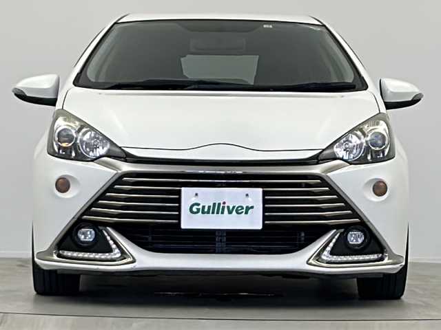 トヨタ アクア G G’s 大阪府 2015(平27)年 13.5万km ライムホワイトパールクリスタルシャイン 純正７インチSDナビ/・TV/CD/DVD/ブルートゥース/バックカメラ/Ｇ｀ｓ専用17インチＡＷ/Ｇ｀ｓ専用フロントバンパー/Ｇ｀ｓ専用リアバンパー/Ｇ｀ｓ専用プッシュスターター/Ｇ｀ｓ専用ハーフレザーシート/Ｇ｀ｓ専用フロアマット/アルミペダル/クルーズコントロール/革巻きステアリング/LEDヘッドライト