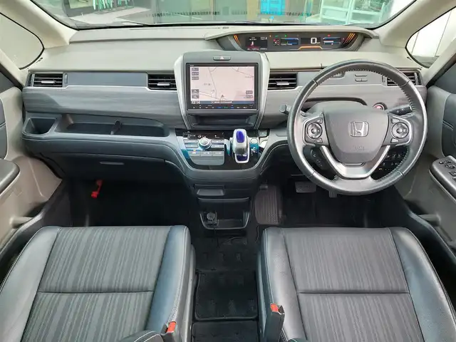 ホンダ フリード ハイブリット G ホンダセンシング 東京都 2018(平30)年 7.7万km ホワイトオーキッドパール 純正9インチナビ(VXM-175VFNi)/【CD/DVD/FM/AM/TV/ipod/SD/USB/BT/VTR/ AUX/HDMI】/バックカメラ/ビルトインETC/両側電動スライドドア/アダクティブクルーズコントロール/衝突軽減ブレーキ/LKAS/LEDヘッドライト/Sパッケージ/・ハーフレザーシート/・純正15インチAW/・本革巻きステアリング/プッシュスタート/スマートキー