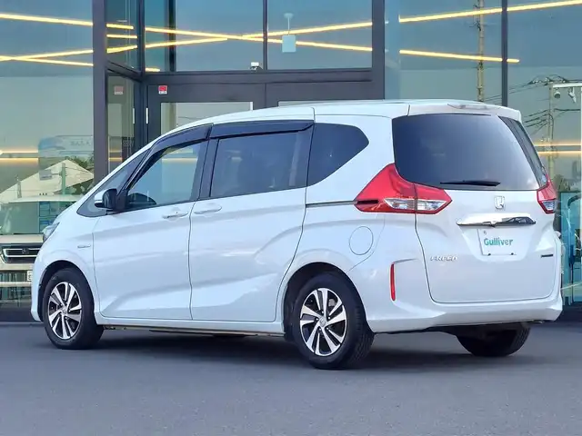 ホンダ フリード ハイブリット G ホンダセンシング 東京都 2018(平30)年 7.7万km ホワイトオーキッドパール 純正9インチナビ(VXM-175VFNi)/【CD/DVD/FM/AM/TV/ipod/SD/USB/BT/VTR/ AUX/HDMI】/バックカメラ/ビルトインETC/両側電動スライドドア/アダクティブクルーズコントロール/衝突軽減ブレーキ/LKAS/LEDヘッドライト/Sパッケージ/・ハーフレザーシート/・純正15インチAW/・本革巻きステアリング/プッシュスタート/スマートキー