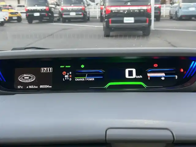 ホンダ フリード ハイブリット EX 岡山県 2016(平28)年 5.4万km ホワイトオーキッドパール 登録時走行距離58334km/ワンオーナー/純正9インチナビ/フルセグTV(AM/FM/CD/DVD/Bluetooth/HDMI)/純正12.8インチフリップダウンモニター/バックカメラ/両側パワースライドドア/ビルトインETC/ホンダセンシング/・アダプティブクルーズコントロール/・レーンキープアシスト/・衝突軽減ブレーキ/・路外逸脱抑制機能/・先行車発進お知らせ機能/・標識認識機能/横滑り抑制機能/車両接近通報装置/フロントガラス熱線スイッチ/D/N席シートヒーター/USB入力端子/ロールサンシェード/ハーフレザーシート/15インチ純正AW　/純正フロアマット