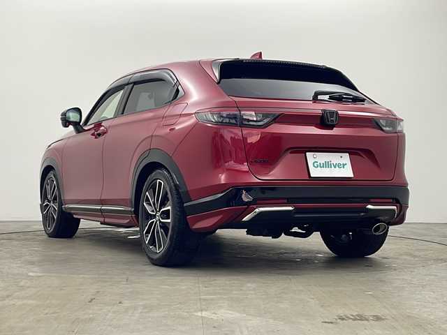 ホンダ ヴェゼル ハイブリッド e:HEV Z 秋田県 2021(令3)年 3.3万km プレミアムクリスタルレッドM 4WD/純正ナビ　/フルセグTV　/全方位カメラ　/ETC2.0/横滑り防止装置 /前後ドライブレコーダー /クルーズコントロール/ステアリングリモコン /プッシュスタート /クリアランスソナー /フロントワイパーデアイサー/ステアリングヒーター/ヒルディセントコントロール/DRIVE　MODE/前席シートヒーター/オートエアコン/パドルシフト/USBポート/革巻きステアリング/ハーフレザーシート/自動パーキングブレーキ/ブレーキホールド/電動リアゲート/コーナーセンサー/プッシュスタート/ワイヤレス充電/フォグライト/サイドバイザー/ウィンカーミラー/純正AW