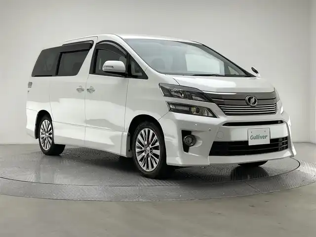 トヨタ ヴェルファイア 2．4Z ゴールデンアイズⅡ 兵庫県 2014(平26)年 4.5万km ホワイトパールクリスタルシャイン 社外メモリナビ/(CN-R300WD)/フルセグ CD DVD BT MSV/フリップダウンモニター/バックカメラ/ビルトインETC/パワーバックドア/ハーフレザーシート/オットマン/両側パワースライドドア/コーナーセンサー/HIDヘッドライト/オートライト/ISOFIX/ドアバイザー/スマートキー