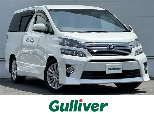 トヨタ ヴェルファイア 2．4Z 佐賀県 2014(平26)年 12.6万km ホワイトパールクリスタルシャイン アルパイン10インチSDナビ/・バックカメラ/・フルセグTV/BT/CD/DVD/アルパインフリップダウンモニター/コーナーセンサー/クルーズコントロール/両側パワースライドドア/純正18インチAW/HIDヘッドライト/オートライト/フォグランプ/オットマン/ETC/スペアキー×１/取扱説明書/保証書