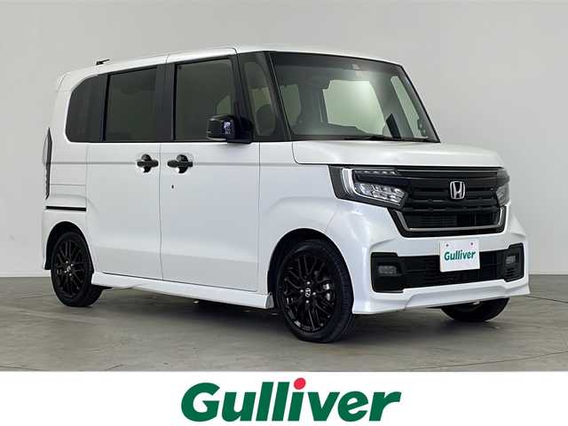 ホンダ Ｎ ＢＯＸ カスタム L ターボ スタイル+ブラック 鹿児島県 2022(令4)年 2.2万km プラチナホワイトパール 純正８インチナビ/（CD/DVD/Bluetooth/AM/FM/USB/SD/フルセグTV）/バックカメラ/シーケンシャルウインカー/ホンダセンシング/・衝突軽減ブレーキ/・レーンキープアシスト/・アダプティブクルーズコントロール/・誤発進抑制機能/・標識認識機能/・オートマチックハイビーム/パドルシフト/サイド＆カーテンエアバッグ/ETC/両側パワースライドドア/シートヒーター/LEDヘッドライト/純正１５インチアルミホイール/純正フロアマット/スマートキー/スペアキー有