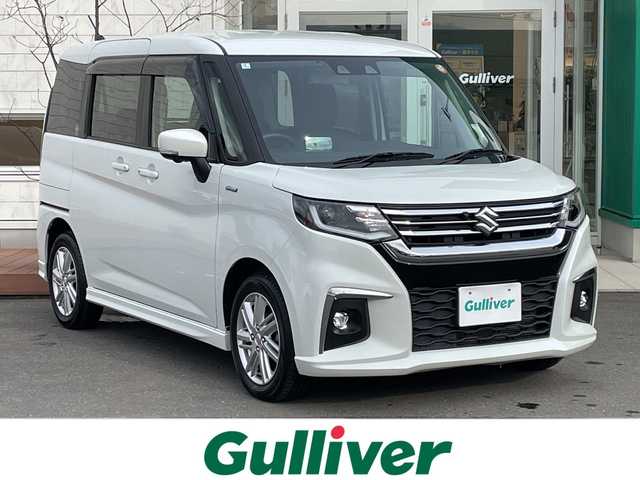 スズキ ソリオ HV MZ 青森県 2024(令6)年 1.1万km ピュアホワイトP 4WD/純正9インチメモリナビ・フルセグTV/CD・DVD・Bluetooth・USB/全方位カメラ/両側パワースライドドア/ヘッドアップディスプレイ/前席シートヒーター/セーフティサポート/デュアルカメラブレーキサポート/追従クルーズコントロール/レーンキープアシスト/ハイビームアシスト/車線逸脱警報/リアパーキングセンサー/ビルトインETC/シートバックテーブル/後席ロールサンシェード/LEDヘッドライト/オートライト/LEDフォグランプ/純正15インチアルミ