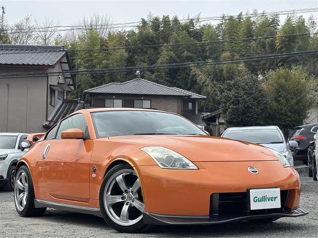 日産 フェアレディ Ｚ バージョンNISMO 熊本県 2007(平19)年 10.9万km プレミアムパッショネイトオレンジ 純正エアロパーツ/リアウィング/ブレンボキャリパー/社外ナビ(AVIC-VH099G)/【ワンセグTV/CD/DVD】/バックカメラ /ハーフレザーシート/純正18インチアルミホイール/オーバーフェンダー/純正フロアマット/横滑り防止装置/盗難防止装置/取扱説明書/保証書/リモコンキー