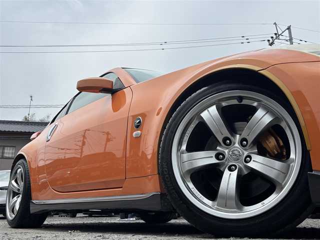 日産 フェアレディ Ｚ バージョンNISMO 熊本県 2007(平19)年 10.9万km プレミアムパッショネイトオレンジ 純正エアロパーツ/リアウィング/ブレンボキャリパー/社外ナビ(AVIC-VH099G)/【ワンセグTV/CD/DVD】/バックカメラ /ハーフレザーシート/純正18インチアルミホイール/オーバーフェンダー/純正フロアマット/横滑り防止装置/盗難防止装置/取扱説明書/保証書/リモコンキー