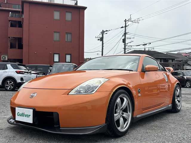 日産 フェアレディ Ｚ バージョンNISMO 熊本県 2007(平19)年 10.9万km プレミアムパッショネイトオレンジ 純正エアロパーツ/リアウィング/ブレンボキャリパー/社外ナビ(AVIC-VH099G)/【ワンセグTV/CD/DVD】/バックカメラ /ハーフレザーシート/純正18インチアルミホイール/オーバーフェンダー/純正フロアマット/横滑り防止装置/盗難防止装置/取扱説明書/保証書/リモコンキー