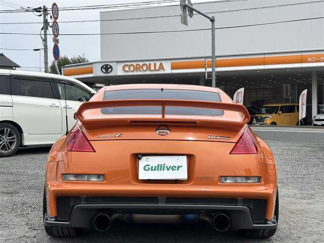 日産 フェアレディ Ｚ バージョンNISMO 熊本県 2007(平19)年 10.9万km プレミアムパッショネイトオレンジ 純正エアロパーツ/リアウィング/ブレンボキャリパー/社外ナビ(AVIC-VH099G)/【ワンセグTV/CD/DVD】/バックカメラ /ハーフレザーシート/純正18インチアルミホイール/オーバーフェンダー/純正フロアマット/横滑り防止装置/盗難防止装置/取扱説明書/保証書/リモコンキー