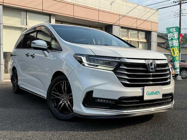 ホンダ オデッセイ ハイブリッド e:HEVアブソルート EX 静岡県 2021(令3)年 4.9万km プラチナホワイトパール ワンオーナー・保証書/走行48989キロ（登録時）/検査令和8年2月4日まで/衝突軽減ブレーキ/車線逸脱支援システム/両側パワースライドドア/パワーバックドア/Gathers10インチプレミアム/　　　　　　　　　　インターナビ/　・DVD再生可能 /Bluetooth/　・フルセグTV   /SD音楽録音/AC100V  1500W/全方位カメラ/ビルトインETC2.0/ナビ連動ドライブレコーダー/アダプティブクルーズコントロール/ハーフレザーシート/前席パワーシート・シートヒーター/スマートキー×2/プッシュスタート/LEDヘッドライト/純正18インチアルミ/オットマン/デッキボード＆ラゲッジBOX/フットライト/マッドガード/純正フロアマット/純正ドアバイザー/車両取説＋ナビ取説