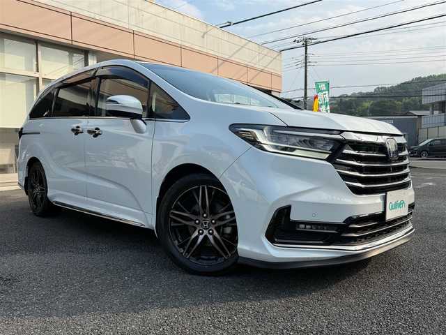 ホンダ オデッセイ ハイブリッド e:HEVアブソルート EX 静岡県 2021(令3)年 4.9万km プラチナホワイトパール ワンオーナー・保証書/走行48989キロ（登録時）/検査令和8年2月4日まで/衝突軽減ブレーキ/車線逸脱支援システム/両側パワースライドドア/パワーバックドア/Gathers10インチプレミアム/　　　　　　　　　　インターナビ/　・DVD再生可能 /Bluetooth/　・フルセグTV   /SD音楽録音/AC100V  1500W/全方位カメラ/ビルトインETC2.0/ナビ連動ドライブレコーダー/アダプティブクルーズコントロール/ハーフレザーシート/前席パワーシート・シートヒーター/スマートキー×2/プッシュスタート/LEDヘッドライト/純正18インチアルミ/オットマン/デッキボード＆ラゲッジBOX/フットライト/マッドガード/純正フロアマット/純正ドアバイザー/車両取説＋ナビ取説