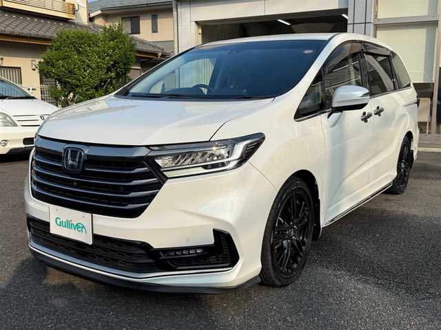 ホンダ オデッセイ ハイブリッド e:HEVアブソルート EX 静岡県 2021(令3)年 4.9万km プラチナホワイトパール ワンオーナー・保証書/走行48989キロ（登録時）/検査令和8年2月4日まで/衝突軽減ブレーキ/車線逸脱支援システム/両側パワースライドドア/パワーバックドア/Gathers10インチプレミアム/　　　　　　　　　　インターナビ/　・DVD再生可能 /Bluetooth/　・フルセグTV   /SD音楽録音/AC100V  1500W/全方位カメラ/ビルトインETC2.0/ナビ連動ドライブレコーダー/アダプティブクルーズコントロール/ハーフレザーシート/前席パワーシート・シートヒーター/スマートキー×2/プッシュスタート/LEDヘッドライト/純正18インチアルミ/オットマン/デッキボード＆ラゲッジBOX/フットライト/マッドガード/純正フロアマット/純正ドアバイザー/車両取説＋ナビ取説