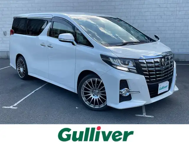 トヨタ アルファード S Aパッケージ 静岡県 2016(平28)年 6.5万km ホワイトパールクリスタルシャイン ワンオーナー/純正ナビ/・フルセグＴＶ/・Ｂｌｕｅｔｏｏｔｈ接続/・ＤＶＤ再生/社外フリップダウンモニター/クルーズコントロール/両側パワースライドドア/電動パーキングブレーキ/オートブレーキホールド/AC100V電源/前後コーナーセンサー/プッシュスタート/スマートキー/スペアキー/ビルトインＥＴＣ/ＬＥＤオートライト/純正フロアマット/社外シートカバー/社外20インチアルミホイール