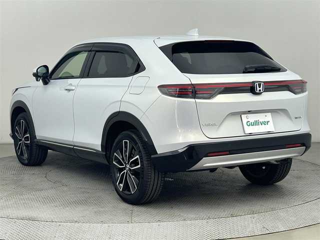 ホンダ ヴェゼル ハイブリッド e:HEV Z 道央・札幌 2024(令6)年 1万km プレミアムサンライトホワイトパール ・4WD/・寒冷地仕様/・純正メモリナビ/・ビルトインETC/・ホンダセンシング/・バックカメラ/・ドライブレコーダー/・アダプティブクルーズコントロール/・電動リアゲート/・ブラインドスポットモニター/・置くだけ充電/・パドルシフト/・シートヒーター/・ステアリングスイッチ/・電動格納ミラー/・ドアバイザー/・LEDヘッドライト/・オートライト/・オートマチックハイビーム/・純正フロアマット/・純正18インチAW/・保証書/・取扱説明書