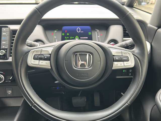 ホンダ フィット e:HEVホーム 埼玉県 2020(令2)年 0.6万km プレミアムクリスタルレッドM 登録時5938km/ワンオーナー/純正SDナビ（VXU-215FTi）/　AM/FM/CD/DVD/BT/MSV/フルセグTV/バックカメラ/純正ナビ連動ドライブレコーダー（前後）/衝突軽減ブレーキ（CMBS）/踏み間違え衝突軽減ブレーキ/路外逸脱抑制機能/横滑り防止機能/コーナーセンサー/プッシュスタート/スマートキー×２/LEDヘッドライト/　オートライト/オートマッチクハイビーム/　ライトレベライザー/電動パーキングブレーキ/オートブレーキホールド/ステアリングリモコン/電動格納機能付ウインカーミラー/ドアバイザー/純正フロアマット/ナビ取扱説明書/取扱説明書/保証書