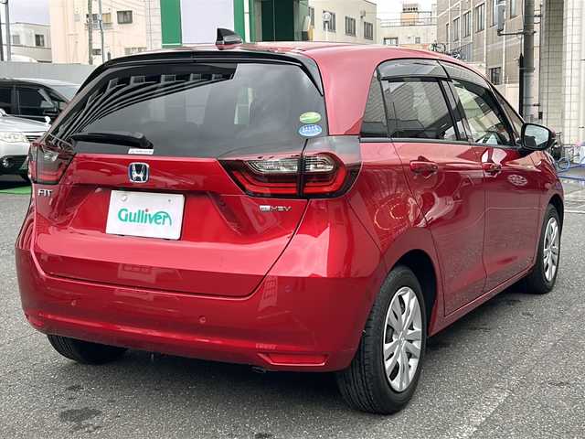 ホンダ フィット e:HEVホーム 埼玉県 2020(令2)年 0.6万km プレミアムクリスタルレッドM 登録時5938km/ワンオーナー/純正SDナビ（VXU-215FTi）/　AM/FM/CD/DVD/BT/MSV/フルセグTV/バックカメラ/純正ナビ連動ドライブレコーダー（前後）/衝突軽減ブレーキ（CMBS）/踏み間違え衝突軽減ブレーキ/路外逸脱抑制機能/横滑り防止機能/コーナーセンサー/プッシュスタート/スマートキー×２/LEDヘッドライト/　オートライト/オートマッチクハイビーム/　ライトレベライザー/電動パーキングブレーキ/オートブレーキホールド/ステアリングリモコン/電動格納機能付ウインカーミラー/ドアバイザー/純正フロアマット/ナビ取扱説明書/取扱説明書/保証書