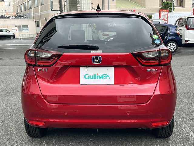 ホンダ フィット e:HEVホーム 埼玉県 2020(令2)年 0.6万km プレミアムクリスタルレッドM 登録時5938km/ワンオーナー/純正SDナビ（VXU-215FTi）/　AM/FM/CD/DVD/BT/MSV/フルセグTV/バックカメラ/純正ナビ連動ドライブレコーダー（前後）/衝突軽減ブレーキ（CMBS）/踏み間違え衝突軽減ブレーキ/路外逸脱抑制機能/横滑り防止機能/コーナーセンサー/プッシュスタート/スマートキー×２/LEDヘッドライト/　オートライト/オートマッチクハイビーム/　ライトレベライザー/電動パーキングブレーキ/オートブレーキホールド/ステアリングリモコン/電動格納機能付ウインカーミラー/ドアバイザー/純正フロアマット/ナビ取扱説明書/取扱説明書/保証書