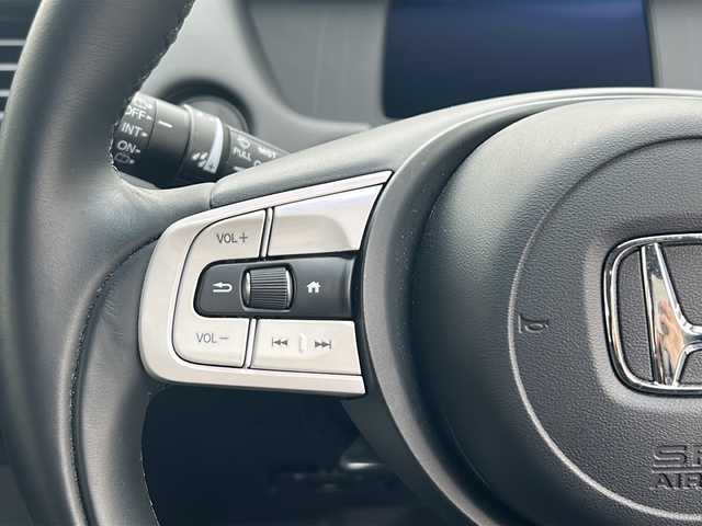 ホンダ フィット e:HEVホーム 埼玉県 2020(令2)年 0.6万km プレミアムクリスタルレッドM 登録時5938km/ワンオーナー/純正SDナビ（VXU-215FTi）/　AM/FM/CD/DVD/BT/MSV/フルセグTV/バックカメラ/純正ナビ連動ドライブレコーダー（前後）/衝突軽減ブレーキ（CMBS）/踏み間違え衝突軽減ブレーキ/路外逸脱抑制機能/横滑り防止機能/コーナーセンサー/プッシュスタート/スマートキー×２/LEDヘッドライト/　オートライト/オートマッチクハイビーム/　ライトレベライザー/電動パーキングブレーキ/オートブレーキホールド/ステアリングリモコン/電動格納機能付ウインカーミラー/ドアバイザー/純正フロアマット/ナビ取扱説明書/取扱説明書/保証書