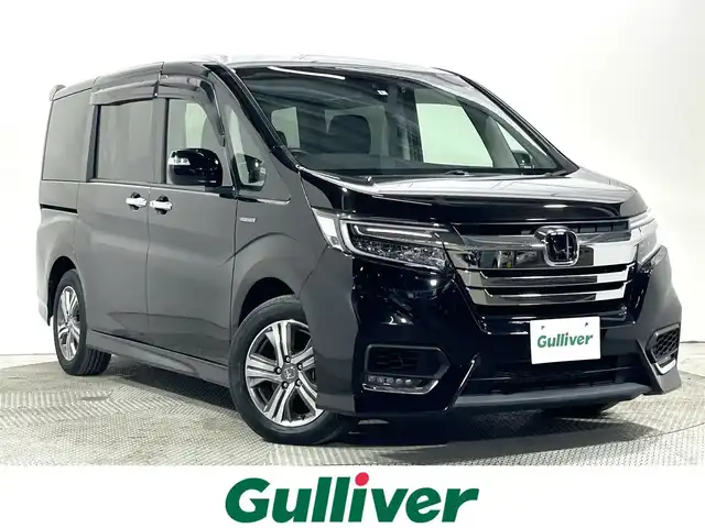 ホンダ ステップワゴン スパーダ eHEV G EXホンダS 大阪府 2020(令2)年 1.1万km プレミアムスパークルブラックパール 純正９ｉｎｃナビ（フルセグ／ＤＶＤ再生／Ｂｌｕｅｔｏｏｔｈ）　バックカメラ　ＥＴＣ　両側パワースライドドア　衝突軽減　レーダークルコン　レーンアシスト　ハーフレザー　シートヒーター　前後ドラレコ