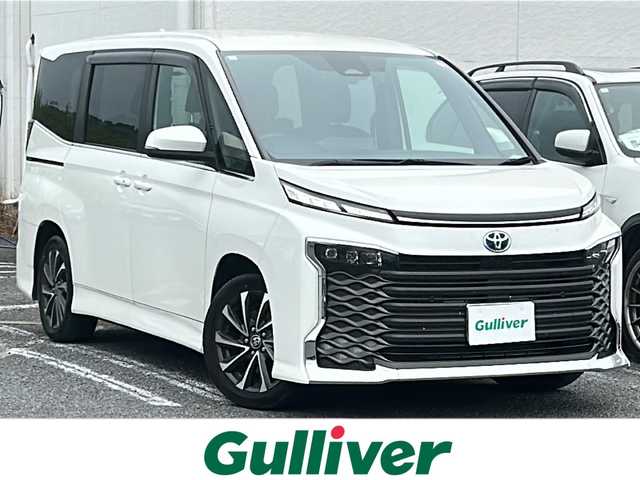 トヨタ ヴォクシー ハイブリッド S－Z 千葉県 2023(令5)年 2.1万km ホワイトパールクリスタルシャイン 1オーナー 10.5型ナビ フルセグ DVD フリップダウンモニター 快適利便パック 電動リアドア 両側電動スライドドア シートヒーター ステアヒーター 2.0ETC ドラレコ AC100V LED