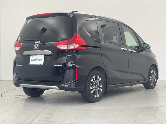 ホンダ フリード ハイブリット クロスター 愛知県 2023(令5)年 1.8万km クリスタルブラックパール 純正ナビ/・Bluetooth/・CD/バックカメラ/両側パワースライドドア/ホンダセンシング/・衝突軽減システム/・レーンキープアシスト/・コーナーセンサー（リア）/・レーダークルーズコントロール/運転席/助手席シートヒーター/電動格納ミラー/ETC/LEDアクティブコーナリングライト/LEDフォグライト