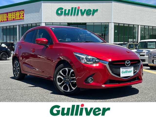 マツダ デミオ XD ツーリング 鳥取県 2015(平27)年 7.5万km ソウルレッドプレミアムメタリック ディーゼル・ターボ車/純正ナビ/BT/USB/バックカメラ/フロントブラインドカメラ/ETC/ドライブレコーダー/衝突被害軽減システム/前後コーナーセンサー/クルーズコントロール/ヘットアップディスプレイ/社外ボンネットダンパー(AutoExe)/LEDヘットライト/純正16インチアルミホイール/プッシュエンジンスタート/アイドリングストップ/スペアキー