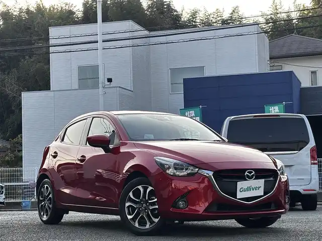 マツダ デミオ XD ツーリング 熊本県 2015(平27)年 7.5万km ソウルレッドプレミアムメタリック 純正ナビ/【Bluetooth/USB】/バックカメラ/フロントカメラ/衝突軽減システム/ヘッドアップディスプレイ/ステアリングスイッチ/クルーズコントロール/M/Tモード/アイドリングストップ/コーナーセンサー/LEDヘッドライト/ETC/ドライブレコーダー/社外ボンネットダンパー(AutoExe)/純正16インチアルミホイール/プッシュスタート/取扱説明書/保証書