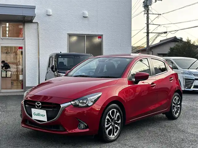 マツダ デミオ XD ツーリング 熊本県 2015(平27)年 7.5万km ソウルレッドプレミアムメタリック 純正ナビ/【Bluetooth/USB】/バックカメラ/フロントカメラ/衝突軽減システム/ヘッドアップディスプレイ/ステアリングスイッチ/クルーズコントロール/M/Tモード/アイドリングストップ/コーナーセンサー/LEDヘッドライト/ETC/ドライブレコーダー/社外ボンネットダンパー(AutoExe)/純正16インチアルミホイール/プッシュスタート/取扱説明書/保証書