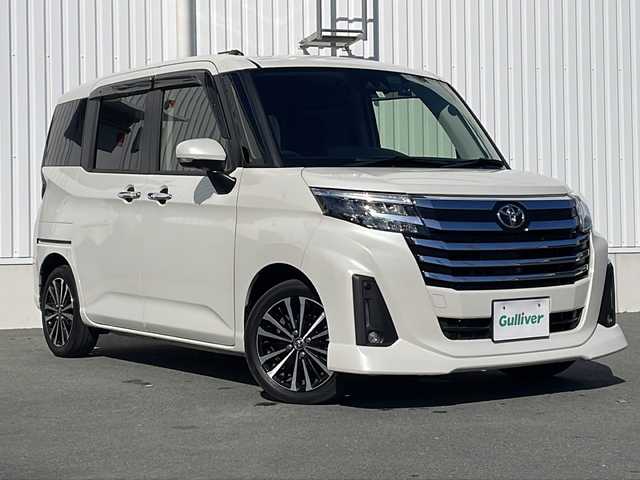 トヨタ ルーミー カスタムG－T 三重県 2023(令5)年 4.8万km パールホワイトⅢ 純正ディスプレイオーディオ/AppleCarPlay、AndroidAuto/両側パワースライドドア/全方位カメラ/衝突軽減ブレーキ/前後コーナーセンサー/前後ドライブレコーダー/追従型クルーズコントロール/純正アルミ15インチ/アイドリングストップ/シートヒーター/レザー調シートカバー/スマートキー/プッシュスタート/ビルトインETC/USB給電/オートホールド/LEDライト/フォグランプ/ウィンカーミラー/フロアマット/ドアバイザー
