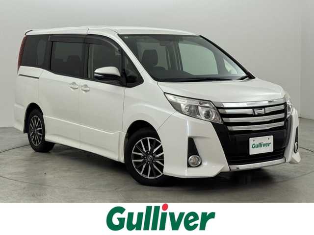 トヨタ ノア Si 福岡県 2015(平27)年 9.8万km ホワイトパールクリスタルシャイン フリップダウンモニター　/純正ナビ（ＢＴ，フルセグＴＶ）　/バックカメラ　/ビルトインＥＴＣ　/衝突軽減ブレーキ　/レーンキープ　/アイドリングストップ　/方側電動スライドドア　/ＭＴモード付き　/純正１６インチＡＷ