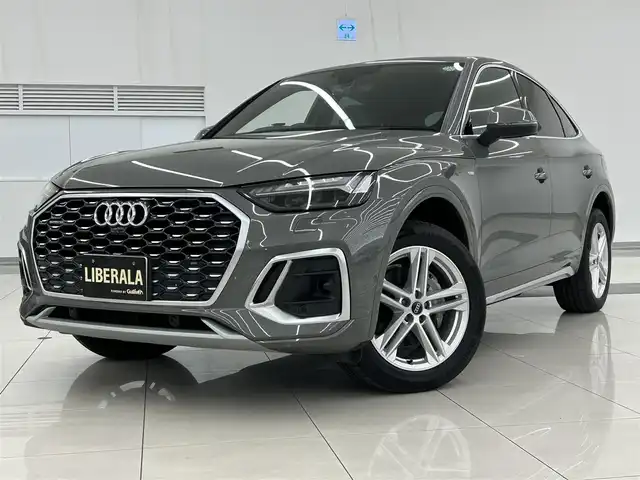 アウディ アウディ Ｑ５ SB 40TDIクワトロ Sライン 岡山県 2023(令5)年 2万km グレー ACC/衝突軽減B/アクティブレーンアシスト/パノラマサンルーフ/バーチャルコックピット/純正ナビ/全方位カメラ/フルセグTVチューナー/AppleCarPlay/AndroidAuto/アンビエントライト/アウディドライブセレクト/シートヒーター/純正19インチアルミ/・Sラインプラスパッケージ/アーティフィシャルインテリアレザー/全席シートヒーター/アコースティックガラス/・コンフォートパッケージ/ワイヤレスチャージ/リヤシートUSBチャージング/ステアリングヒーター/純正前後ドラレコ