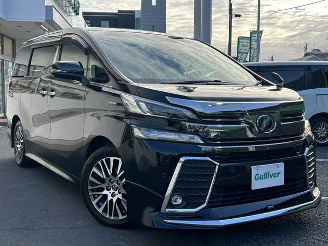 トヨタ ヴェルファイア Z Gエディション 千葉県 2015(平27)年 8.8万km ブラック 純正ナビ（NSZT-ZA4T）/　・フルセグTV/CD/SD/DVD/Blue Tooth/バックカメラ/レーダークルーズ/モデリスタリップスポイラー/ビルトインETC/LEDヘッドライト/両側パワスラドア/サンルーフ/ステアリングヒーター/100V充電/オットマン/取説/保証書/スペアキー