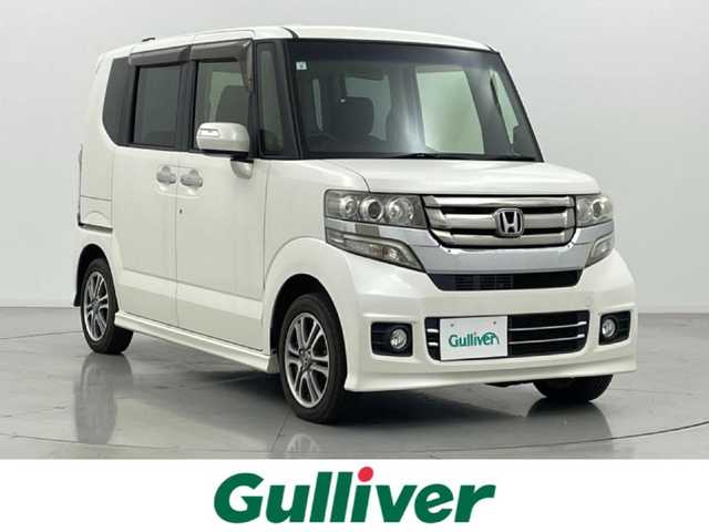 ホンダ Ｎ ＢＯＸ カスタム G Lパッケージ 熊本県 2015(平27)年 5.5万km プレミアムホワイトパールⅡ 社外ナビAVN-Z04i（ＣＤ・ＤＶＤ・フルセグ・ＢＴ・ＳＤ）/片側パワースライドドア　/横滑り防止　/アイドリングストップ　/電動格納ミラー/社外フロアマット　/純正１４インチＡＷ　/オートライト　/ＨＩＤライト　/フォグランプ/スマートキー　/プッシュスタート