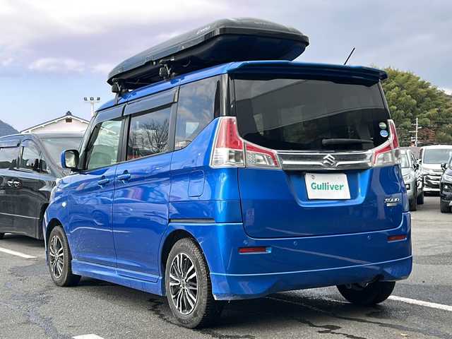 スズキ ソリオ GX2 京都府 2020(令2)年 8.3万km スピーディーブルーM 社外ナビ/ワンセグ/Bluetooth/CD・DVD/衝突軽減装置/レーダークルーズ/両側パワースライドドア/バックカメラ/ETC/シートヒーター/クリアランスソナー/禁煙車/ドアバイザー/スマートキー/プッシュスタート/電動格納ミラー