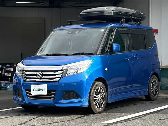 スズキ ソリオ GX2 京都府 2020(令2)年 8.3万km スピーディーブルーM 社外ナビ/ワンセグ/Bluetooth/CD・DVD/衝突軽減装置/レーダークルーズ/両側パワースライドドア/バックカメラ/ETC/シートヒーター/クリアランスソナー/禁煙車/ドアバイザー/スマートキー/プッシュスタート/電動格納ミラー