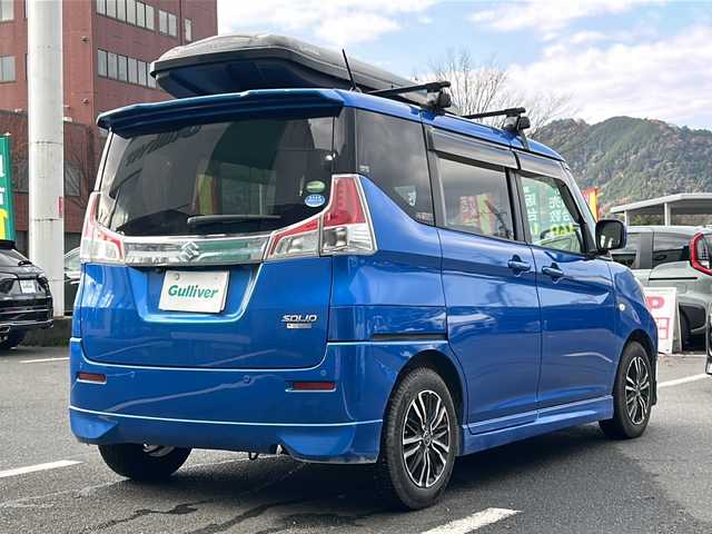 スズキ ソリオ GX2 京都府 2020(令2)年 8.3万km スピーディーブルーM 社外ナビ/ワンセグ/Bluetooth/CD・DVD/衝突軽減装置/レーダークルーズ/両側パワースライドドア/バックカメラ/ETC/シートヒーター/クリアランスソナー/禁煙車/ドアバイザー/スマートキー/プッシュスタート/電動格納ミラー