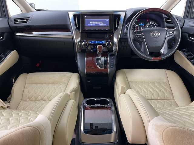 トヨタ ヴェルファイア V 道央・札幌 2015(平27)年 5.2万km バーニングブラッククリスタルシャインガラスフレーク ・4WD/・ワンオーナー/・純正ナビ/・BT&CD&DVD&SD＆フルセグTV/・バックカメラ/・純正フリップダウンモニター/・両側パワースライドドア/・助手席ロングスライド/・クルーズコントロール/・ハーフレザーシート/・D席メモリ付パワーシート/・ビルトインETC/・TVキャンセラー/・オットマン/・ステアリングスイッチ/・オートライト/・LEDヘッドライト/・プッシュスタート/・スマートキー/・スペアキー×1