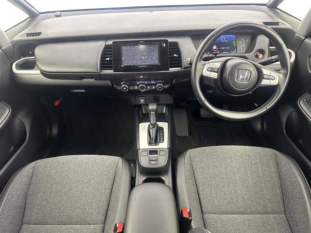 ホンダ フィット e:HEVホーム 愛知県 2023(令5)年 4.6万km プラチナホワイトパール 社外ナビ/（Bluetooth/CD） /レーダークルーズコントロール　/バックモニター　/コーナーセンサー　/衝突軽減システム　/レーンキープアシスト　/ハーフレザーシート　/オートライト　/電動格納ミラー　/ドライブレコーダー/ETC　/純正ホイールキャップ