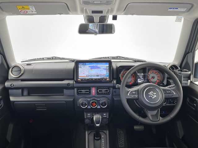 スズキ ジムニー シエラ JC 長野県 2023(令5)年 1.5万km ミディアムグレー 4WD/社外8インチナビ/（フルセグ/Bluetooth/CD/DVD)/ETC/衝突軽減ブレーキ/車線逸脱防止機能/クルーズコントロール/革調シートカバー/前席シートヒーター/2WD/4WD切り替え/ダウンヒルアシストコントロール/LEDヘッドライト/オートライト/SUZUKIグリル/ドアバイザー/ステアリングスイッチ/スマートキー