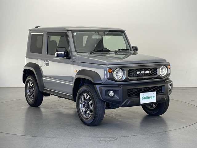 スズキ ジムニー シエラ JC 長野県 2023(令5)年 1.5万km ミディアムグレー 4WD/社外8インチナビ/（フルセグ/Bluetooth/CD/DVD)/ETC/衝突軽減ブレーキ/車線逸脱防止機能/クルーズコントロール/革調シートカバー/前席シートヒーター/2WD/4WD切り替え/ダウンヒルアシストコントロール/LEDヘッドライト/オートライト/SUZUKIグリル/ドアバイザー/ステアリングスイッチ/スマートキー