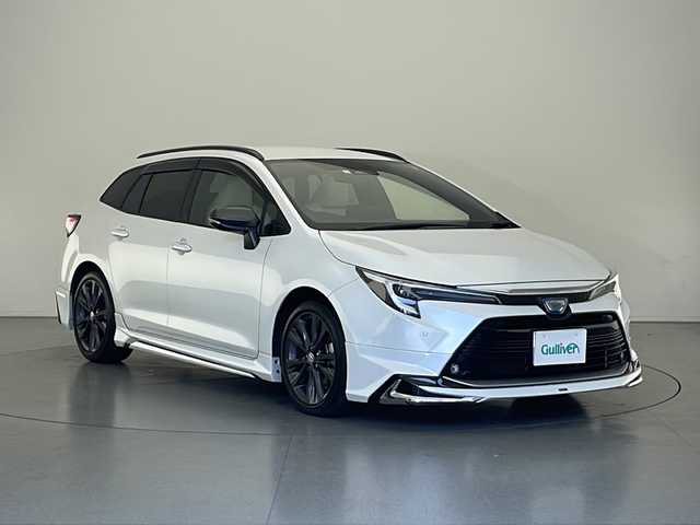 トヨタ カローラツーリング ハイブリッド ダブルバイビー 長野県 2023(令5)年 4.1万km プラチナホワイトパールマイカ 4WD/モデリスタフルエアロ/純正ディスプレイオーディオ&BT/トヨタセーフティセンス/アダプティブクルーズコントロール/レーンディパーチャーアラート/プリクラッシュセーフティ/パーキングサポートブレーキ/ブラインドスポットモニター/リアクロストラフィックアラート/ロードサインアシスト/オートマチックハイビーム/ハーフレザーシート/前席シートヒーター/革巻きステアリング/ステアリングスイッチ/ステアリングヒーター/バックカメラ/ビルトインETC2.0/LEDヘッドライト/オートライト/フロントフォグランプ/電動格納ミラー/ウィンカーミラー/ドアミラーヒーター/電動ホールド/オートホールド/純正17インチAW装着/純正フロアマット/ドアバイザー/ルーフレール/プッシュスタート/スマートキー/取扱説明書/保証書