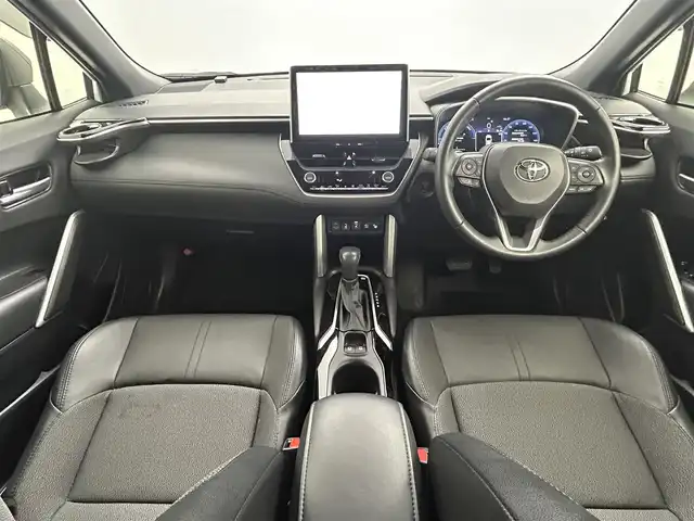 トヨタ カローラ クロス ハイブリッド Z 熊本県 2024(令6)年 1.1万km アティチュードブラックマイカ/プラチナホワイトパールマイカ ワンオーナー　/禁煙車　/モデリスタエアロフル　/１０．５インチディスプレイオーディオ（ＡｐｐｌＣａｒＰｌａｙ・ＡｎｄｒｏｉｄＡｕｔｏ・ＢＴ・フルセグ）/アラウンドビューモニター/社外前後ドライブレコーダー/トヨタセーフティーセンス/・プリクラッシュセーフティ/・レーンディパーチャーアラート/・ブラインドスポットモニター/・リアクロストラフィックアラート/・駐車時支援パーキングサポートシステム/・ロードサインアシスト/・レ前席シートヒーター/・レーーダークルーズコントロール/横滑り防止/前席シートヒーター/運転席パワーシート/ハーフレザーシート/デジタルインナーミラー/ルーフレール/純正フロアマット/純正１８インチAW/オートライト/オートマチックハイビーム/LEDヘッドライト/フォグライト/スマートキー/プッシュスタート/スペアキー1本/保証書/取扱説明書