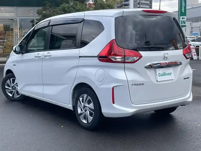 ホンダ フリード ハイブリット G ホンダセンシング 島根県 2020(令2)年 2.1万km プラチナホワイトパール 禁煙車/純正９インチメモリナビ　/フルセグＴＶ　/ＤＶＤ再生　/Ｂｌｕｅｔｏｏｔｈ接続　/バックカメラ　/ＥＴＣ　/前後ドライブレコーダー/両側パワースライドドア　/アダプティブクルーズコントロール　/衝突軽減ブレーキ　/レーンキープアシスト/後方コーナーセンサー　/前席シートヒーター　/スマートキー/純正ＬＥＤヘッドライト　/純正１５インチアルミホイール/純正フロアマット